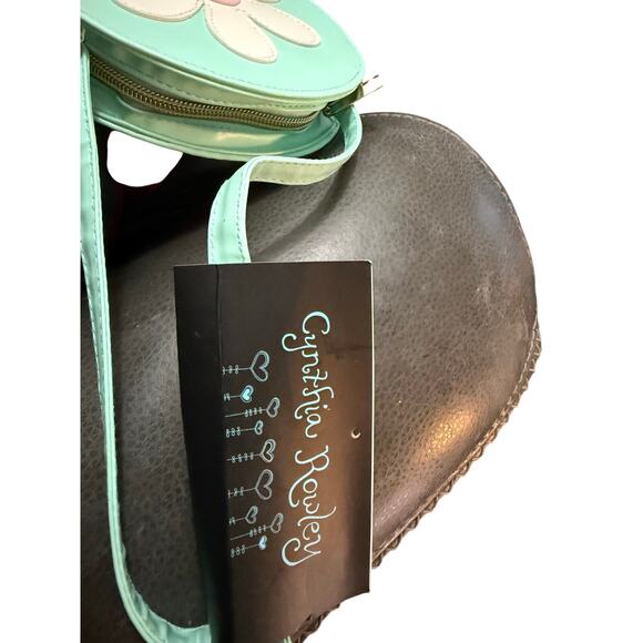 Cynthia Crowley round crossbody purse featuring a playful retro daisy design. - Picture 4 of 4